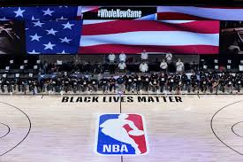 NBA PLAYERS kneel for the  national anthem ahead of a playoff game. Photo courtesy of the Associated Press.