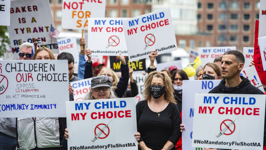 Demonstrators gather to protest a mandatory flu vaccine order for children and to protest government mandates when it comes to medical choices outside the John Joseph Moakley United States Federal Courthouse in Boston, Massachusetts on October 5, 2020. 
