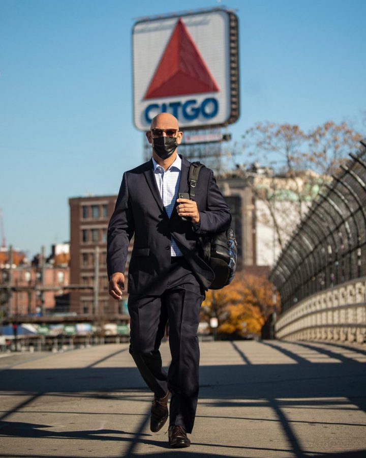 Alex Cora recreating a photo from his first hiring walking away from Fenway Park.